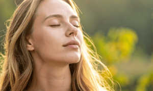 Woman feeling the benefits of meditation, illustrating the benefits of meditation for body and mind.