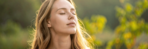 Woman feeling the benefits of meditation, illustrating the benefits of meditation for body and mind.