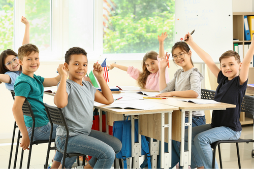 Happy Children Taking Classes at School