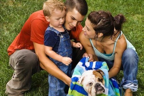 Family washing a dog