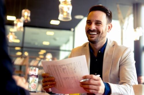 Happy man at desk