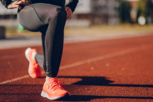 maximise your workout, woman stretching
