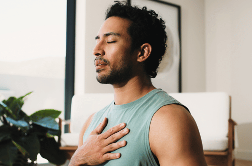 A man dress casually practicing Breathwork for Stress and Anxiety