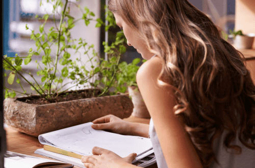 Self-Care for Students by creating student sitting at a desk in a calm study environment.