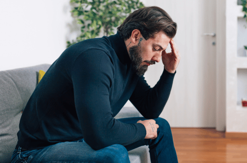 Stressed male team member related to ISO 45003