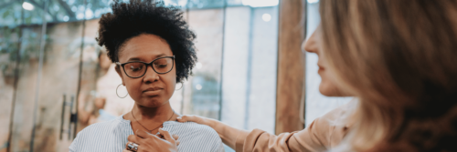 Emotional numbness is felt as a woman is comforted by another woman.