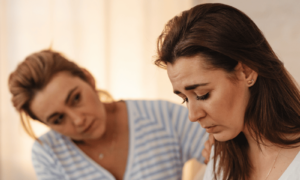 Emotional Contagion as woman takes on emotions while comforting another woman
