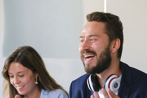 Colleagues at ease in a bright modern office, showing what it looks like when jealousy in relationships at work is handled openly