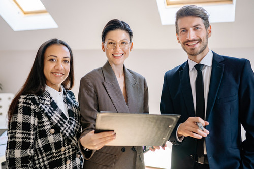 Colleagues at ease together in a bright modern office, working without comparing yourself to others