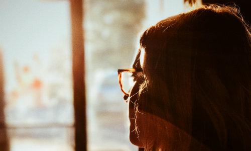 Woman looking out a window