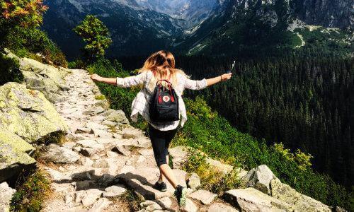 woman hiking, happy, mountains