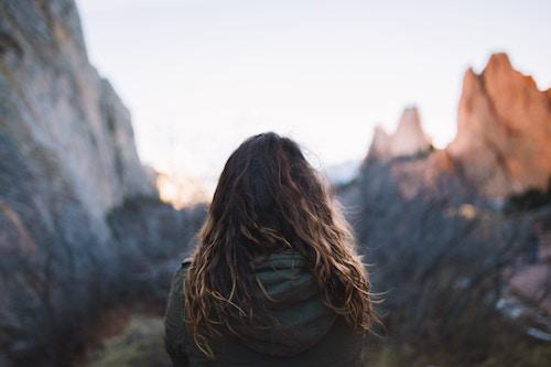 girl standing in mountains