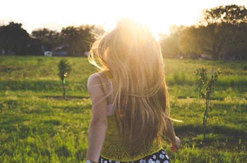 a girl walking in the sun