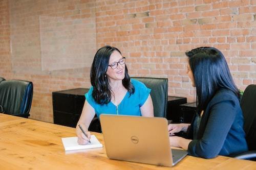 two women discussing business