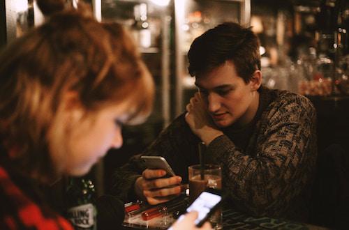 couple on their phones