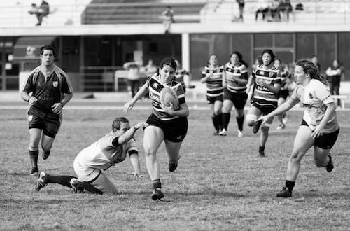 Teens playing rugby