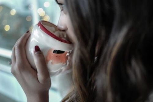 Girl sipping from cup