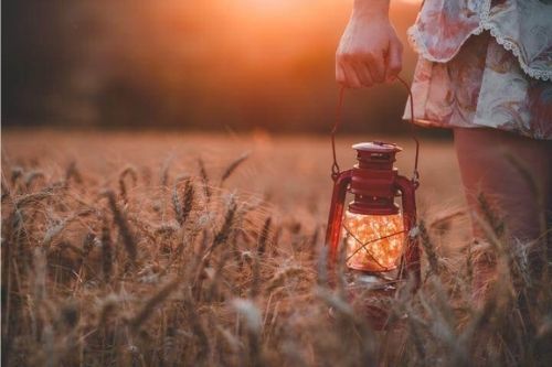 woman holding a lantern