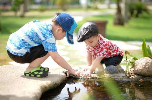 Boys playing near water