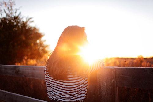 Girl staring at a sunset