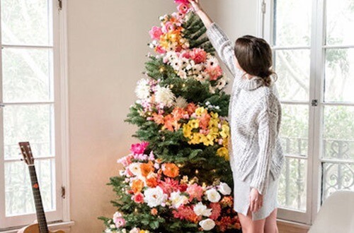 Woman Decorating Christmas Tree