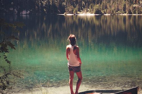 Woman standing near a lake