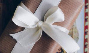 present box wrapped by white banner