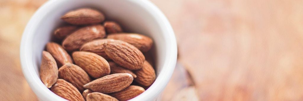 healthy almond nut in small white bowl