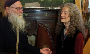elderly couple eyes closed spiritually communicate