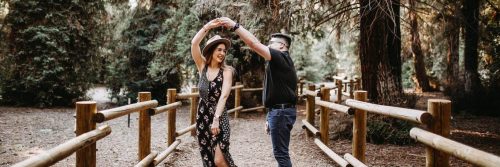 couple happily dance aerobics in forest