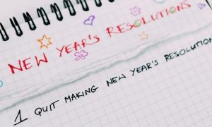 notebook details new year resolutions with subheading 1 quit making new year resolutions