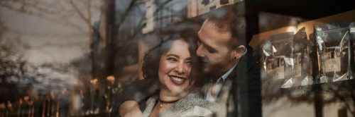 couple happily hugs smiling while man kissing girlfriend