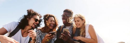 group of friends happily talk laugh discuss about topics on mobile phones
