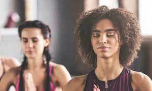 people exercise focus on meditation in fitness club