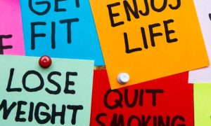 colorful sticky notes detailing healthy lifestyle phrases find love get fit enjoy life join gym quit smoking lose weight