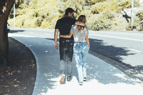 Couple walking down the street